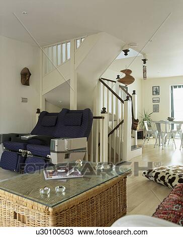 Glass-topped wicker chest in modern open-plan living and living room View Large Photo Image Stock Image - Glass-topped wicker chest in modern open-plan living and living room. Fotosearch
