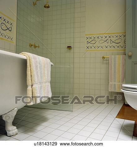 Glass wall divider on wet-room in modern tiled View Large Photo Image Stock Photo - Glass wall divider on wet-room in modern tiled . Fotosearch