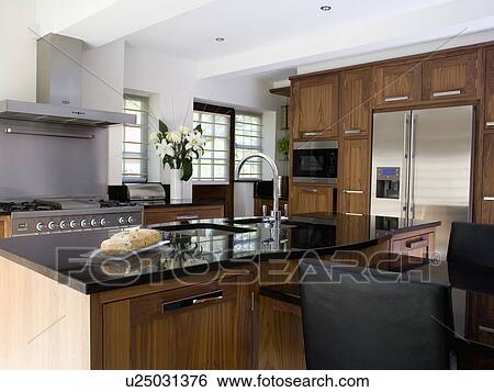 Stock Photograph - Granite worktop on island unit in large modern kitchen. Fotosearch