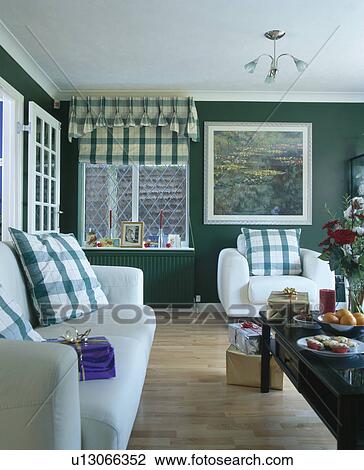 Green Checked Cushions On White Sofa And Armchair In Dark Green