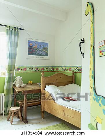 Green dado in child's bedroom with small pine bed View Large Photo Image Picture - Green dado in child's bedroom with small pine bed. Fotosearch