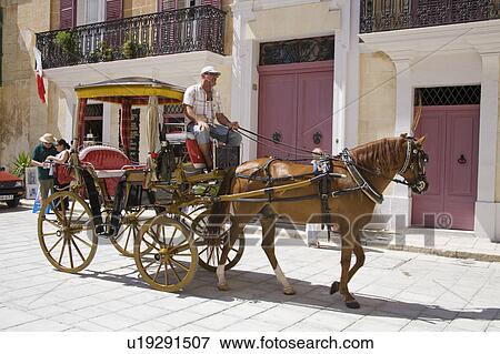 Stock Photo - Horse and carriage in the medieval city of Mdina, Malta . Fotosearch