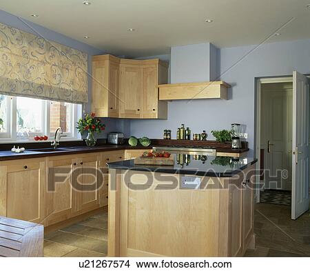 Island unit in modern kitchen with patterned blind on window View Large Photo Image Picture - Island unit in modern kitchen with patterned blind on window. Fotosearch