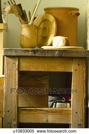 Jug with wooden utensils on old wooden butcher's block View Large Photo Image Stock Photography - Jug with wooden utensils on old wooden butcher's block. Fotosearch