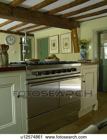 Lacanche stainless steel range oven in beamed cottage kitchen View Large Photo Image Stock Image - Lacanche stainless steel range oven in beamed cottage kitchen . Fotosearch