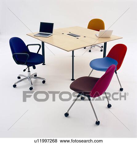 Laptop computer on square table with colourful upholstered office chairs View Large Photo Image Stock Photo - Laptop computer on square table with colourful upholstered office chairs. Fotosearch