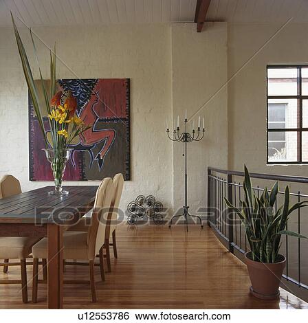 Large abstract painting on wall of modern dining room with wooden floor and cactus View Large Photo Image Stock Photograph - Large abstract painting on wall of modern dining room with wooden floor and cactus. Fotosearch