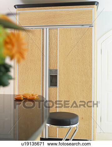 Large American-style refrigerator concealed behind pale wood doors View Large Photo Image Stock Image - Large American-style refrigerator concealed behind pale wood doors. Fotosearch