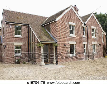 Stock Photography - Large brick newbuild country house. Fotosearch