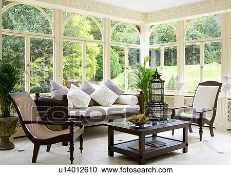 Large Moroccan lantern and planter's chairs in Marston+Langinger conservatory living room View Large Photo Image Stock Image - Large Moroccan lantern and planter's chairs in Marston+Langinger conservatory living room. Fotosearch