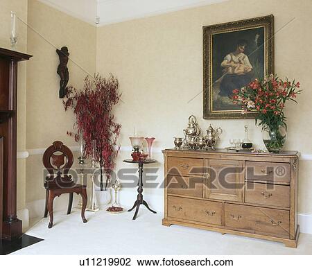 Large picture above old pine sideboard in traditional dining room View Large Photo Image Stock Image - Large picture above old pine sideboard in traditional dining room. Fotosearch