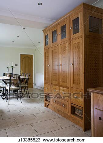 Large Wooden Larder Cupboard In Modern Kitchen Dining Room With Travertine Flooring Stock Image U13385823 Fotosearch