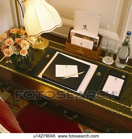 Lighted lamp on leather-bound desk View Large Photo Image Stock Photography - Lighted lamp on leather-bound desk. Fotosearch