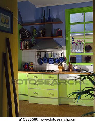 Lime-green cupboards in pastel blue kitchen View Large Photo Image Stock Photograph - Lime-green cupboards in pastel blue kitchen. Fotosearch
