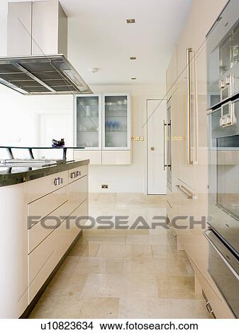Limestone flooring in modern cream kitchen View Large Photo Image Picture - Limestone flooring in modern cream kitchen. Fotosearch
