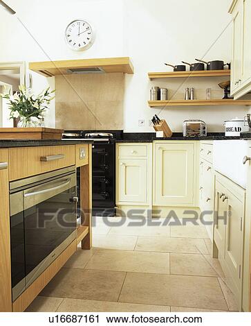 Limestone flooring in modern cream kitchen View Large Photo Image Stock Image - Limestone flooring in modern cream kitchen. Fotosearch