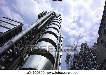 Stock Image - Lloyds of London from the street level looking up the tower.. Fotosearch