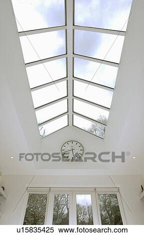 Looking up at glass apex roof of modern kitchen extension View Large Photo Image Stock Photography - Looking up at glass apex roof of modern kitchen extension. Fotosearch