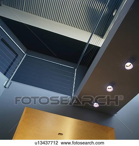 Looking up at metal walkway in modern turquoise blue hall View Large Photo Image Stock Image - Looking up at metal walkway in modern turquoise blue hall. Fotosearch
