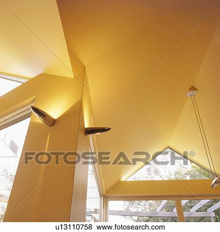 Looking up at wall lights on architectural ceiling View Large Photo Image Stock Photo - Looking up at wall lights on architectural ceiling. Fotosearch