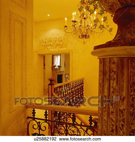 Stock Image - Luxurious Landing with Grand Chandelier.. Fotosearch