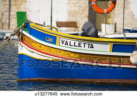 Luzzu fishing boat moored in Saint Julian’s Harbour, Spinola Bay, Saint Julian’s, Malta View Large Photo Image Stock Photography - Luzzu fishing boat moored in Saint Julian’s Harbour, Spinola Bay, Saint Julian’s, Malta. Fotosearch