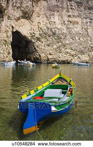Picture - Luzzu fishing boat moored in the Inland Sea, Il-Qawra, Dwejra, Gozo, Malta . Fotosearch