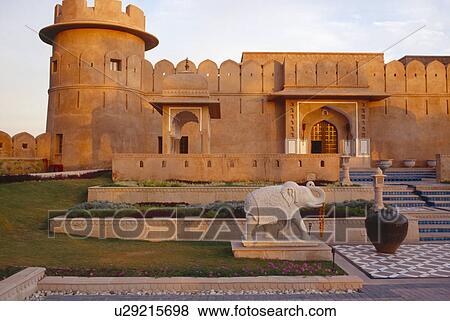 Stock Photo - Marble elephant sculpture in courtyard of sandstone fort at the Rajvilas Hotel near Jaipur in Rajastan. Fotosearch