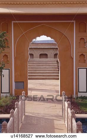 Stock Photo - Marble paving through Mughal arch in courtyard at the Rajvilas Hotel near Jaipur in Rajastan. Fotosearch