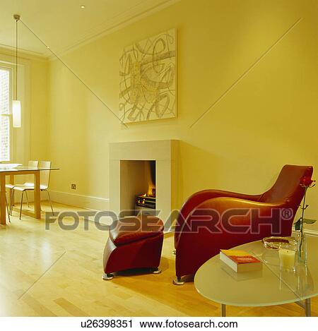 Matthew Hilton "Balzac" armchair and ottoman in modern yellow living room with wooden flooring View Large Photo Image Stock Image - Matthew Hilton "Balzac" armchair and ottoman in modern yellow living room with wooden flooring. Fotosearch