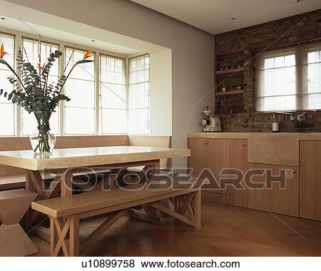 Melamine Topped Table And Wooden Benches In Modern Country Kitchen Stock Photo U10899758 Fotosearch