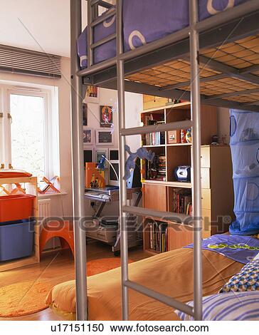 Metal ladder on bunk beds with blue bedlinen in child's modern bedroom View Large Photo Image Stock Image - Metal ladder on bunk beds with blue bedlinen in child's modern bedroom. Fotosearch