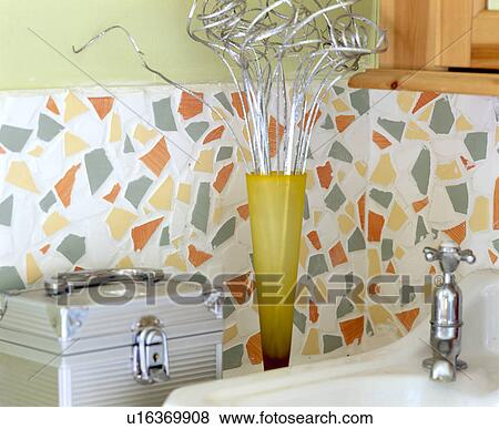 Metal storage box beside basin with chrome tap on basin below mosaic tiled splashback View Large Photo Image Stock Photo - Metal storage box beside basin with chrome tap on basin below mosaic tiled splashback. Fotosearch