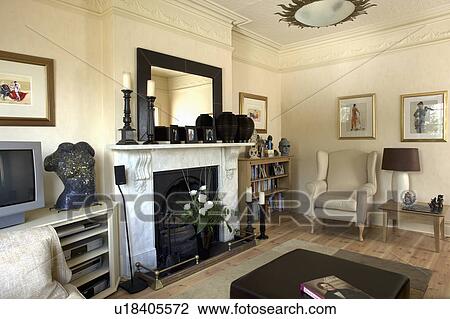 Mirror On Marble Fireplace In Cream Traditional Living Room Stock