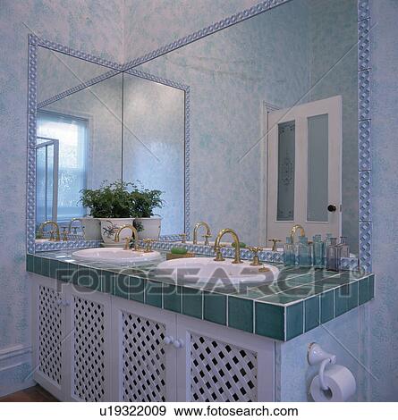 Mirrors above double basins in turquoise-tile topped vanity unit View Large Photo Image Stock Photo - Mirrors above double basins in turquoise-tile topped vanity unit. Fotosearch