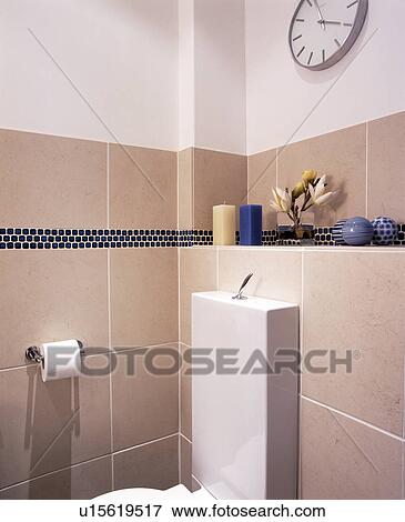 Stock Photo - Modern beige and white tiled bathroom. Fotosearch