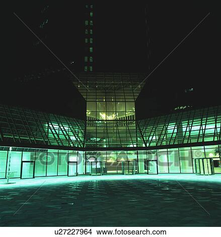 Modern city office block lit at night View Large Photo Image Picture - Modern city office block lit at night. Fotosearch