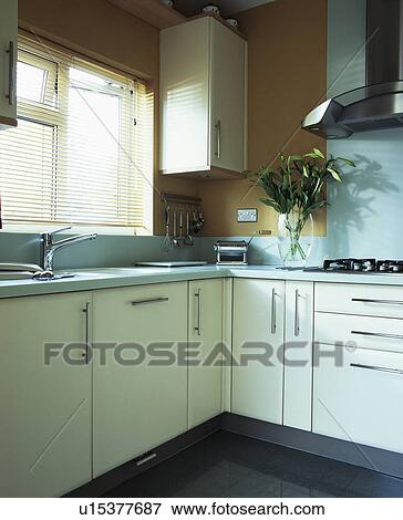 Stock Photo - Modern kitchen with fitted white units. Fotosearch