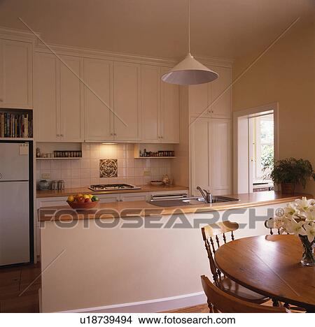 Picture - Modern white kitchen dining room. Fotosearch