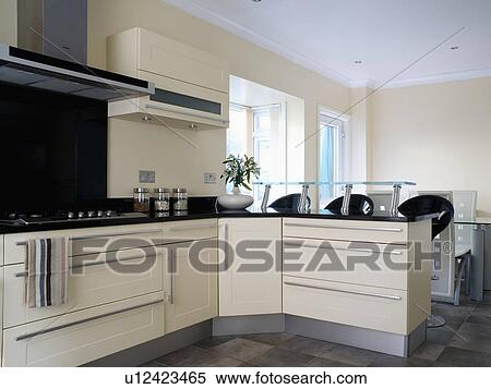 Stock Photography - Modern white kitchen dining room. Fotosearch