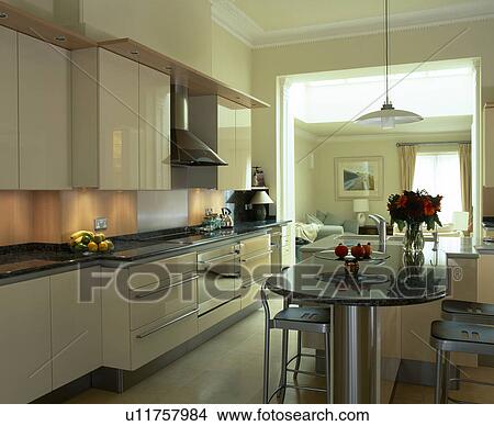 Modern white townhouse kitchen with granite-topped breakfast bar View Large Photo Image Picture - Modern white townhouse kitchen with granite-topped breakfast bar. Fotosearch