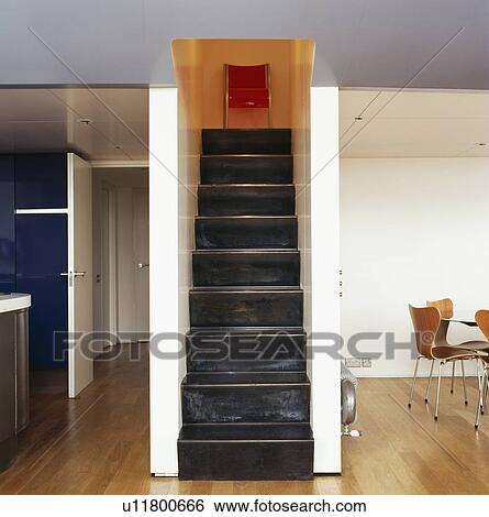 Narrow black metal stairs in apartment in city loft conversion View Large Photo Image Stock Photograph - Narrow black metal stairs in apartment in city loft conversion. Fotosearch