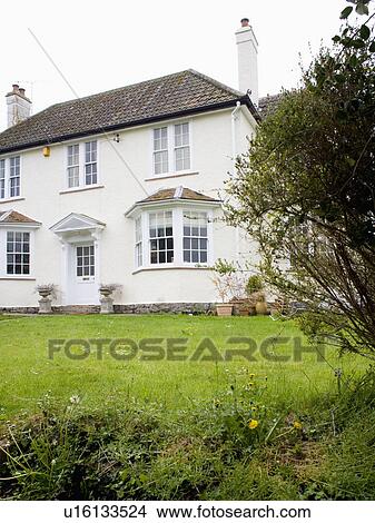 Newly painted traditional white house in the country View Large Photo Image Picture - Newly painted traditional white house in the country. Fotosearch