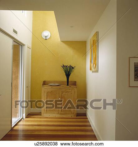 Old pine cupboard against yellow wall in modern white hall View Large Photo Image Stock Photo - Old pine cupboard against yellow wall in modern white hall. Fotosearch