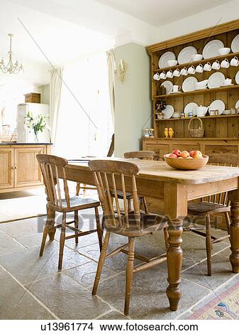 Old Pine Table And Chairs In Country Kitchen With Pine Dresser And