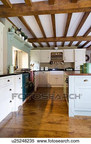 Old wooden floorboards in country kitchen with beamed ceiling View Large Photo Image Stock Photography - Old wooden floorboards in country kitchen with beamed ceiling. Fotosearch