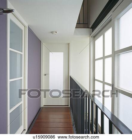 Stock Photograph - Opaque glass windows in modern white hall. Fotosearch