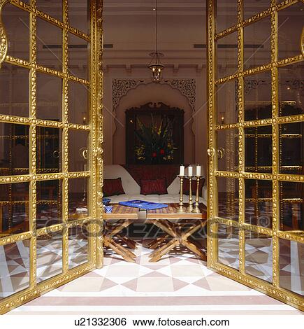 Stock Photograph - Open ornate glass doors to Rajastani bedroom. Fotosearch