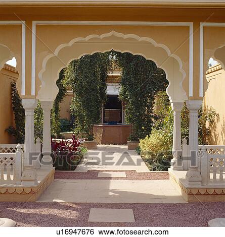 Ornate arch and view of tranquil courtyard at the Rajvilas Hotel near Jaipur in Rajastan View Large Photo Image Stock Photograph - Ornate arch and view of tranquil courtyard at the Rajvilas Hotel near Jaipur in Rajastan. Fotosearch