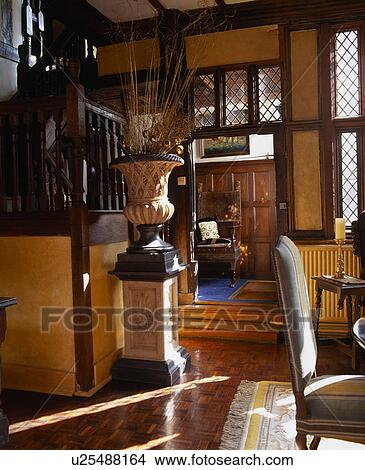 Ornate urn on plinth in Tudor hall View Large Photo Image Picture - Ornate urn on plinth in Tudor hall. Fotosearch